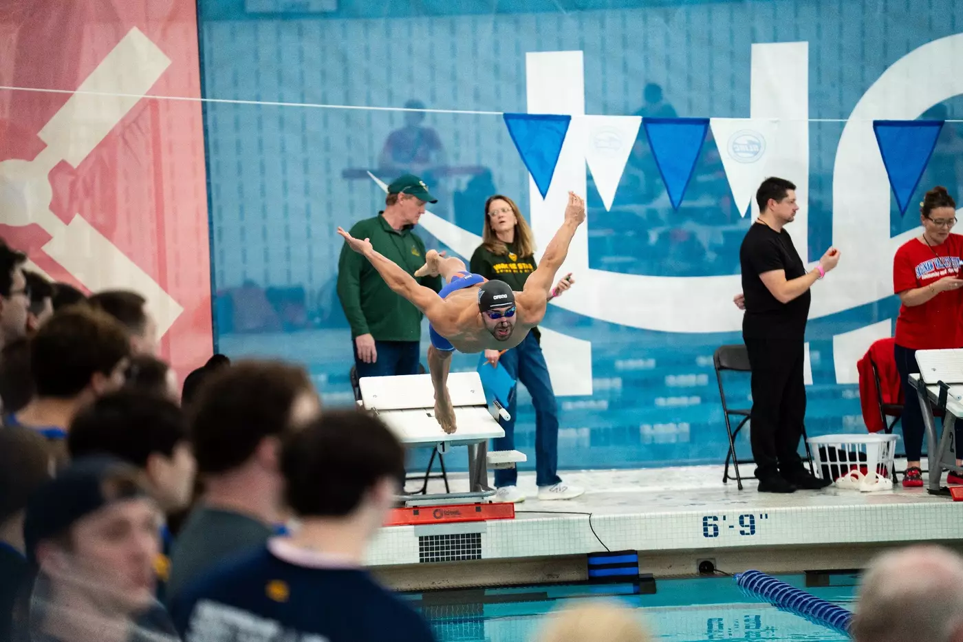 Mahmoud diving off the blocks at the start of a race